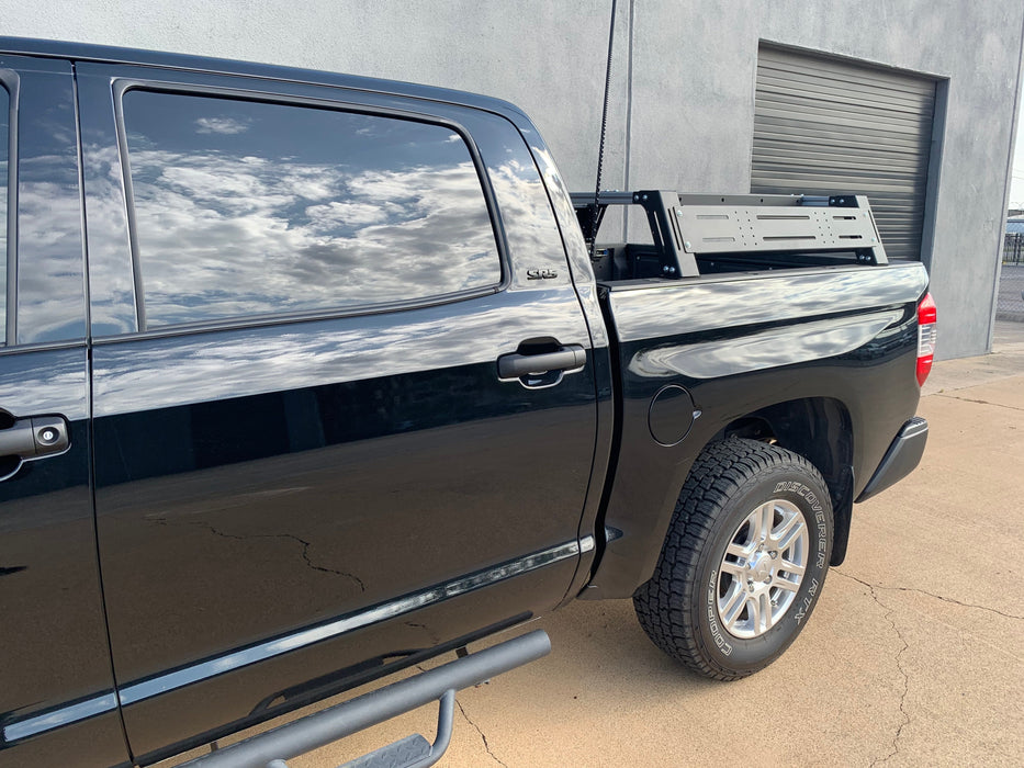 Drivers side angled view of black Toyota Tundra with Overland Bed Rack - Cali Raised LED